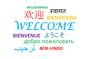 plakat przedstawiający słowa powitania w wielu językach